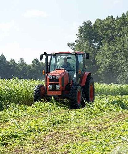 Farmer driving tractor 